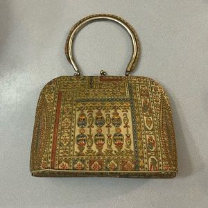 Vintage bag. Hard shell with clamshell opening like new. Cool pattern
